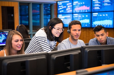 Students with professor in the Trading Room