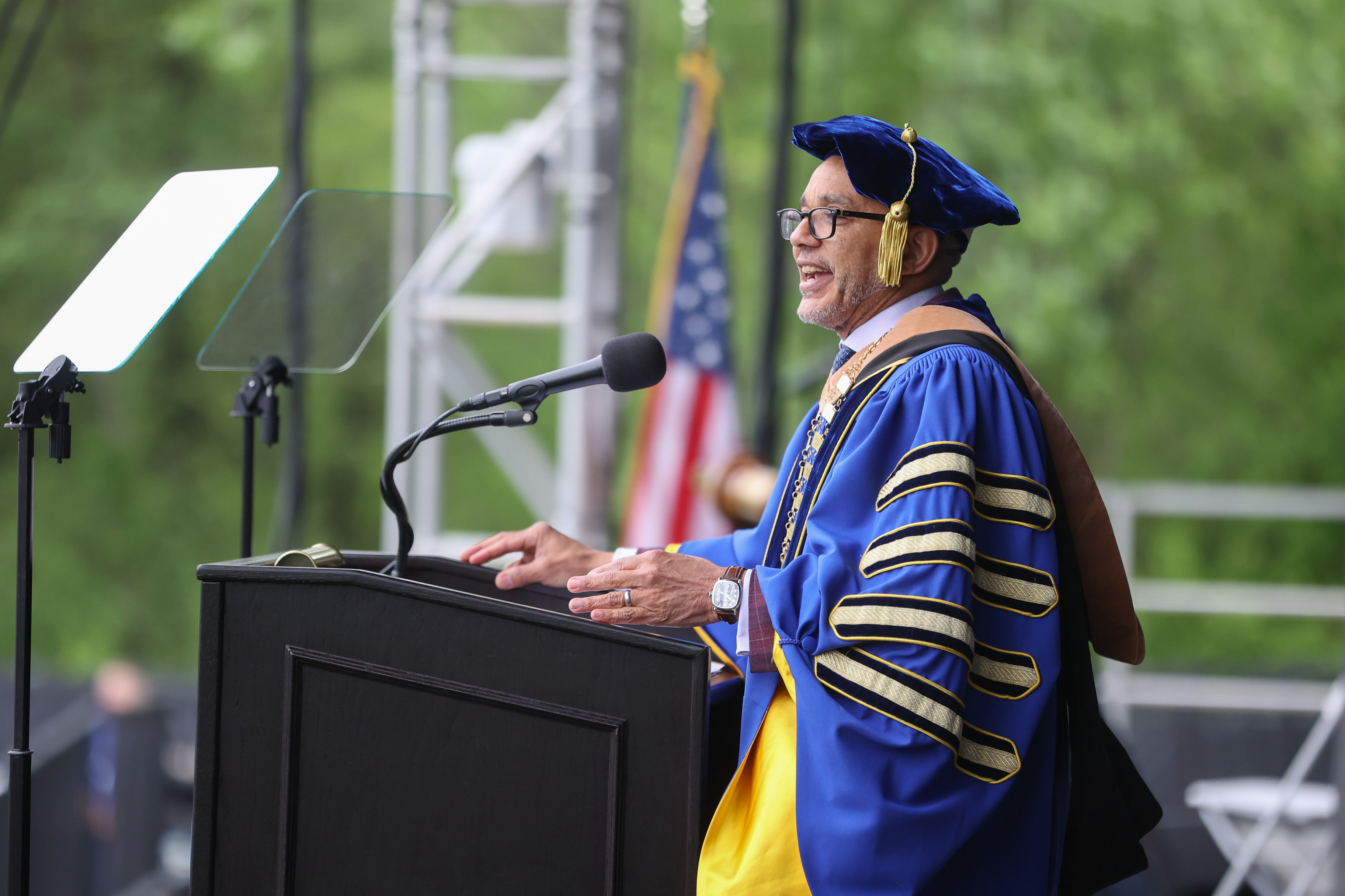 President Chrite delivers the commencement address from behind the podium