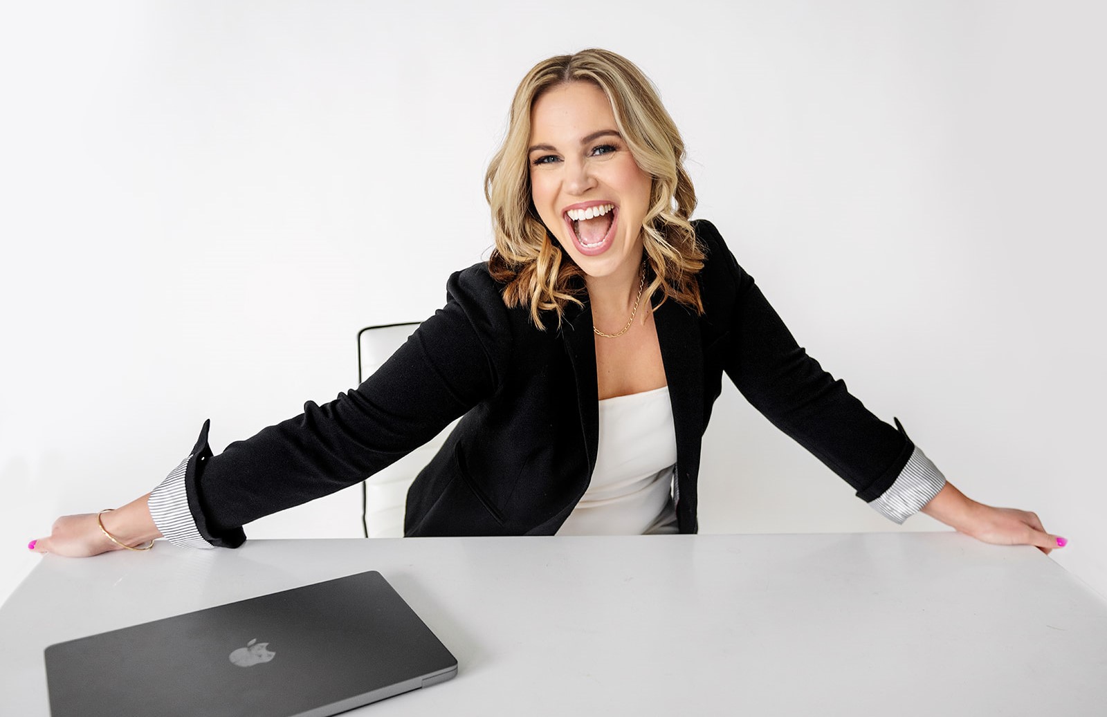 Bold Moves Founder and CEO Amy Pocsik sitting at a desk