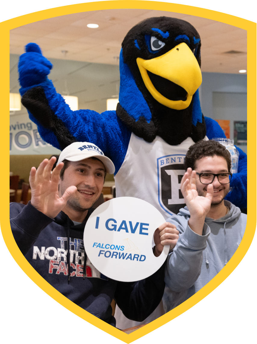 students pose with Flex the falcon