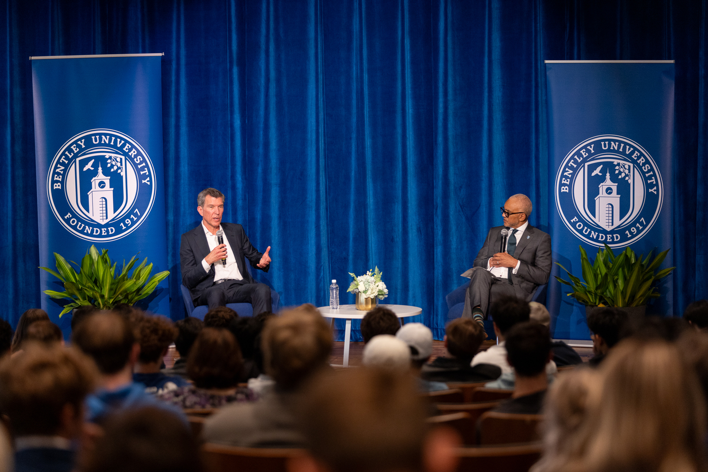 KPMG CEO Paul Knopp conversing with Bentley University President E. LaBrent Chrite