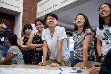 students smile at an event