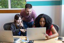 Students looking at Laptop