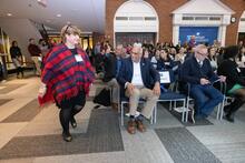 Woman walks to recieve award