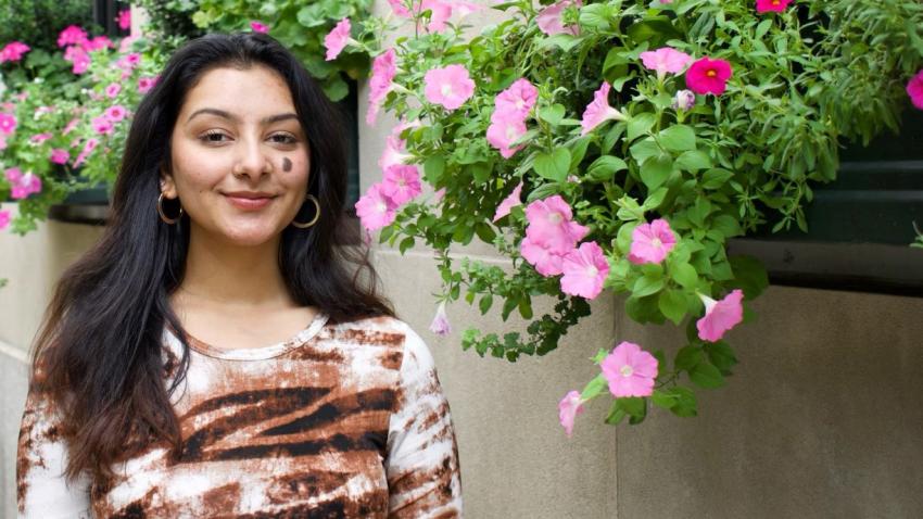 Medha Prakash in front of building with cascading flower boxes