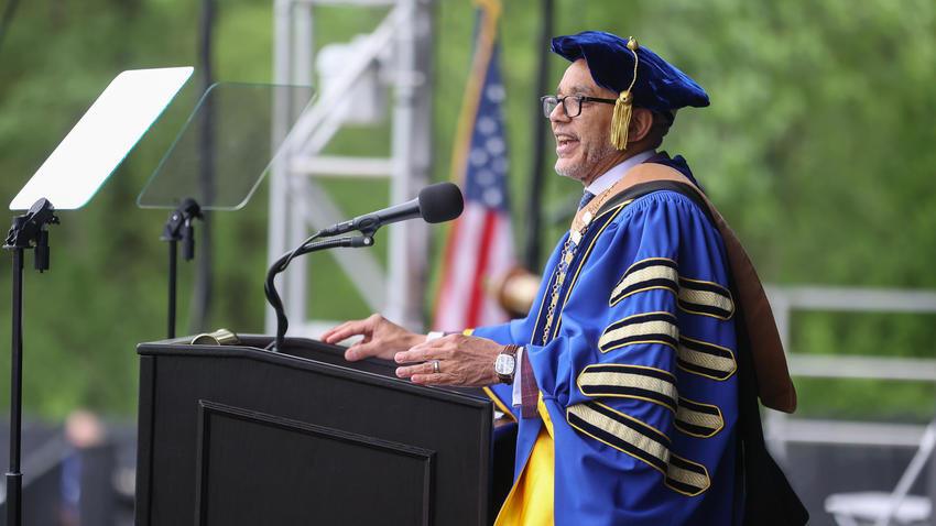 President Chrite delivers the commencement address from behind the podium