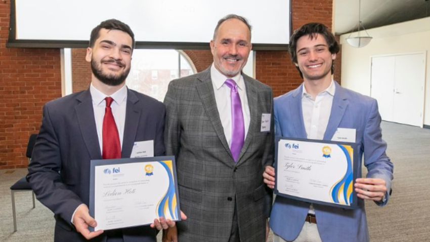 Bentley students and FEI scholarship winners Ledion Hoti ’25 and Tyler Smith ’24 pose with Lecturer in Finance Brian Koeller.