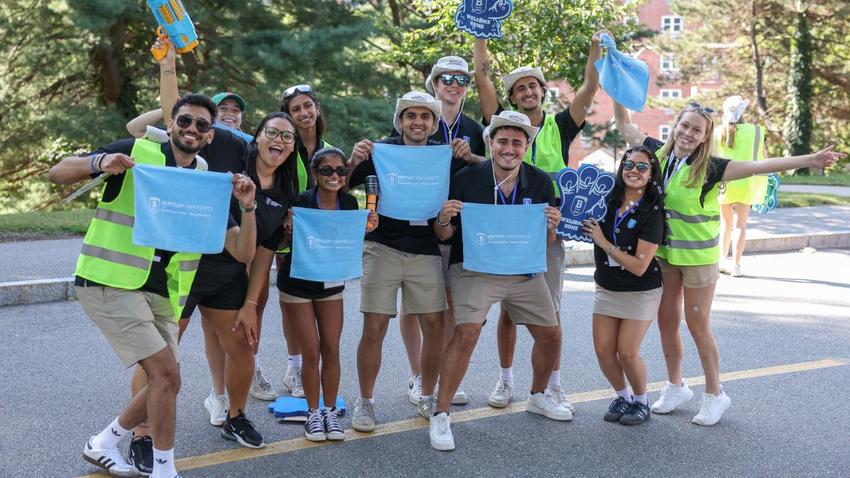 Bentley students volunteers enthusiastically welcoming the Class of 2028