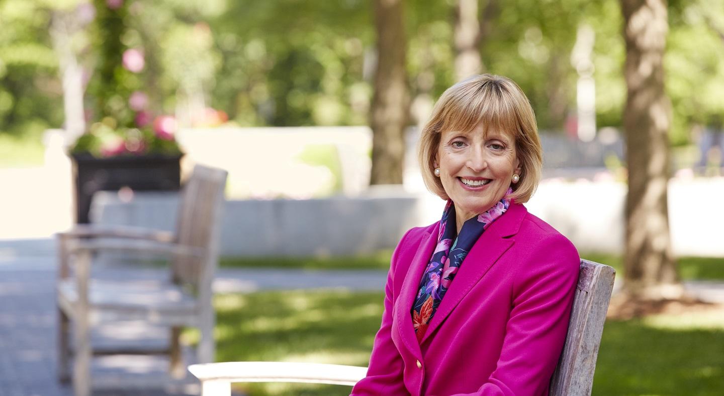 Bentley University President Alison Davis-Blake on a bench Thumbnail