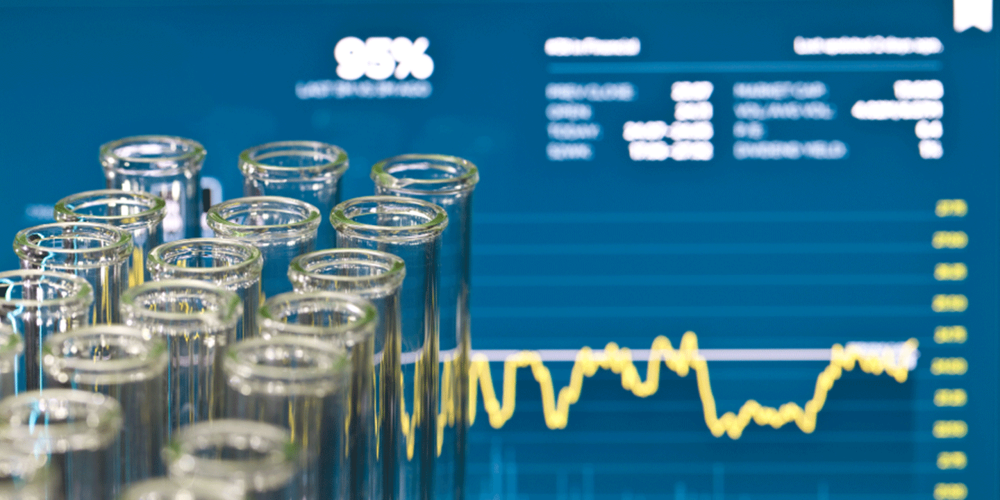 medical lab with computer screen in background providing statistics and analytics