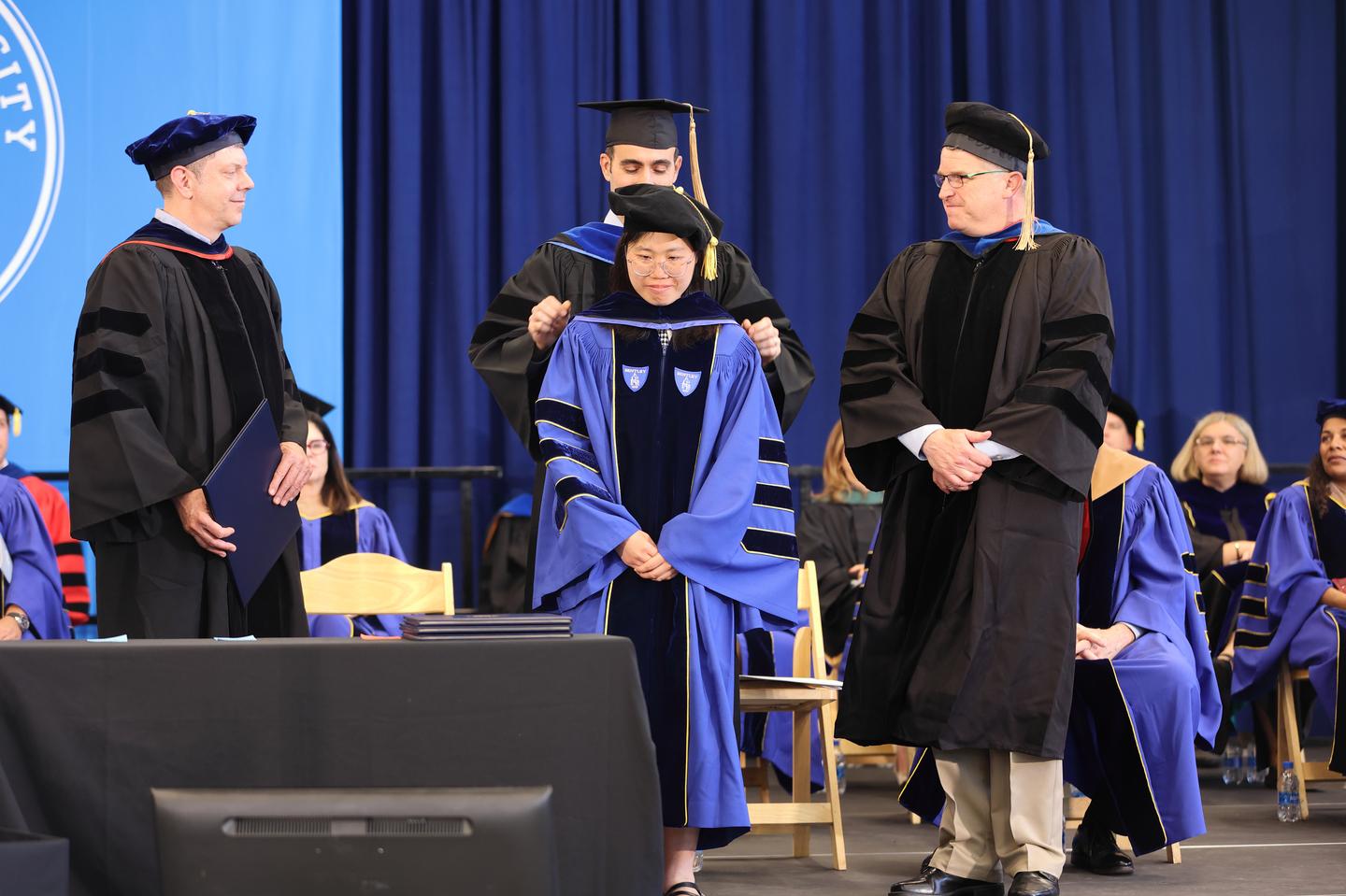 PhD Students Receiving Her Diploma