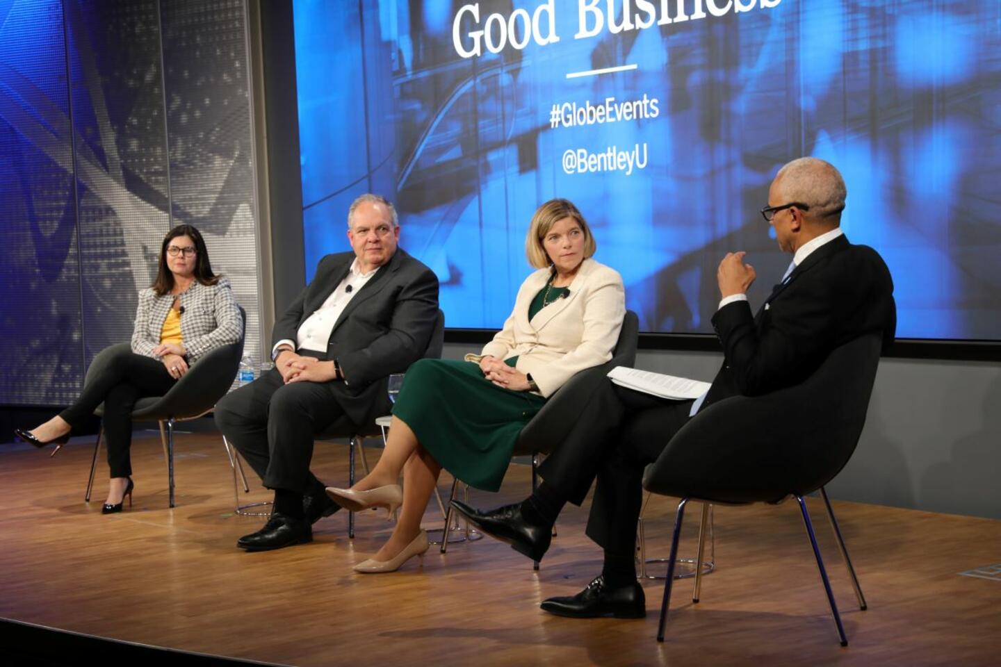 Panelists panel included Melanie Foley, MBA ’02, executive vice president and chief administrative officer at Liberty Mutual Insurance; Ron O’Hanley, CEO at State Street; and Alicia Rose, deputy CEO of strategic initiatives at Deloitte US sitting on a stage with moderator and Bentley president E. LaBrent Chrite