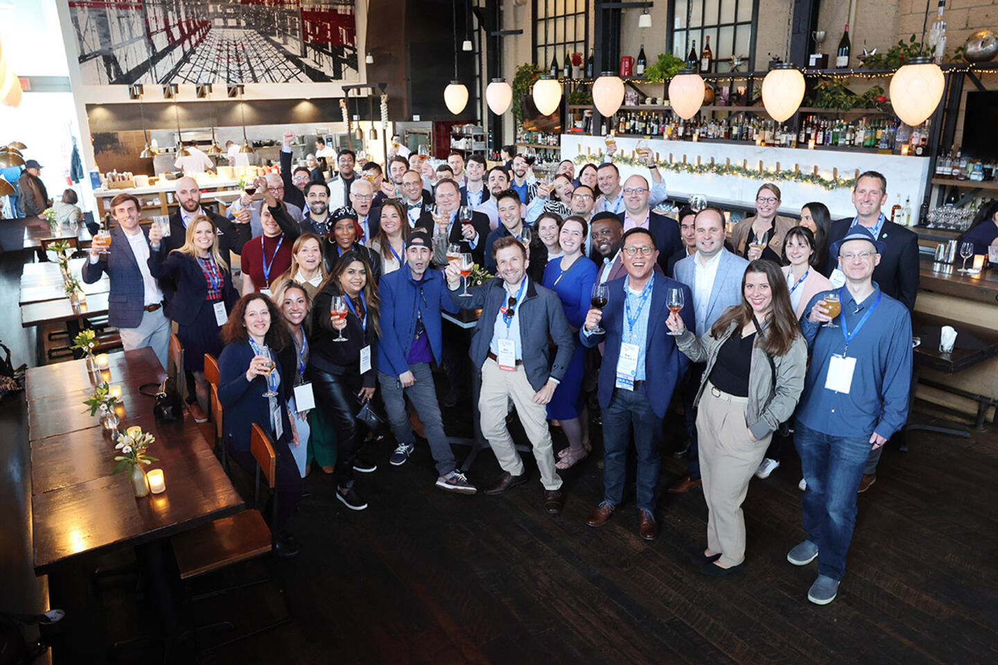 alumni share drinks together at the Bentley Alumni Conference