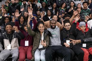 Boston Celtics All-Star wing Jaylen Brown poses with students at Celtics Career Day presented by Bentley University