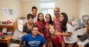Families in dorm at Bentley University for move-in day